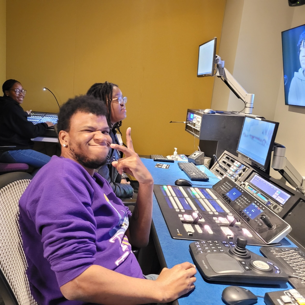 A young man works at an audio visual editing station