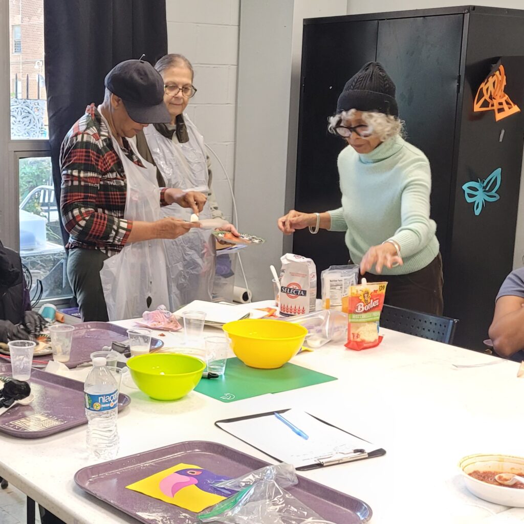 Women at a cooking class looking over ingredients