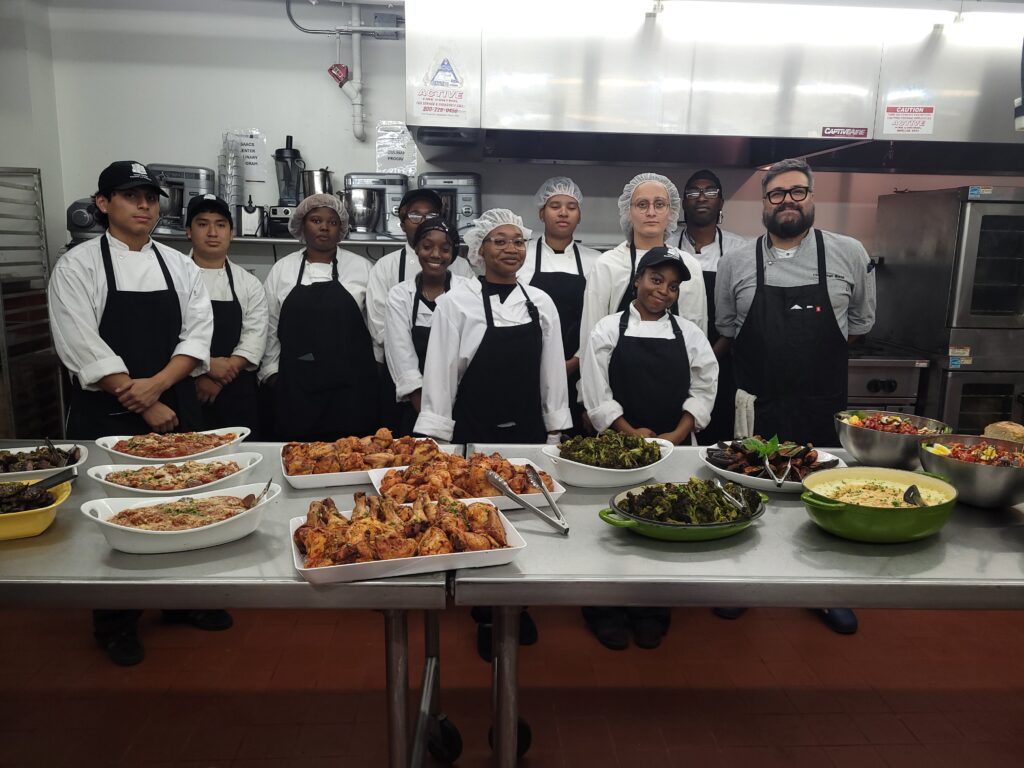 The culinary class and Chef Diego Biondi posing with the food they made