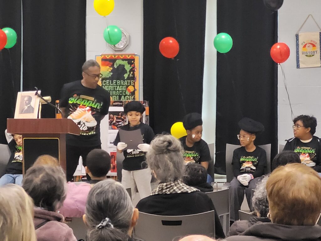 A young historian sharing facts while everyone listens. 