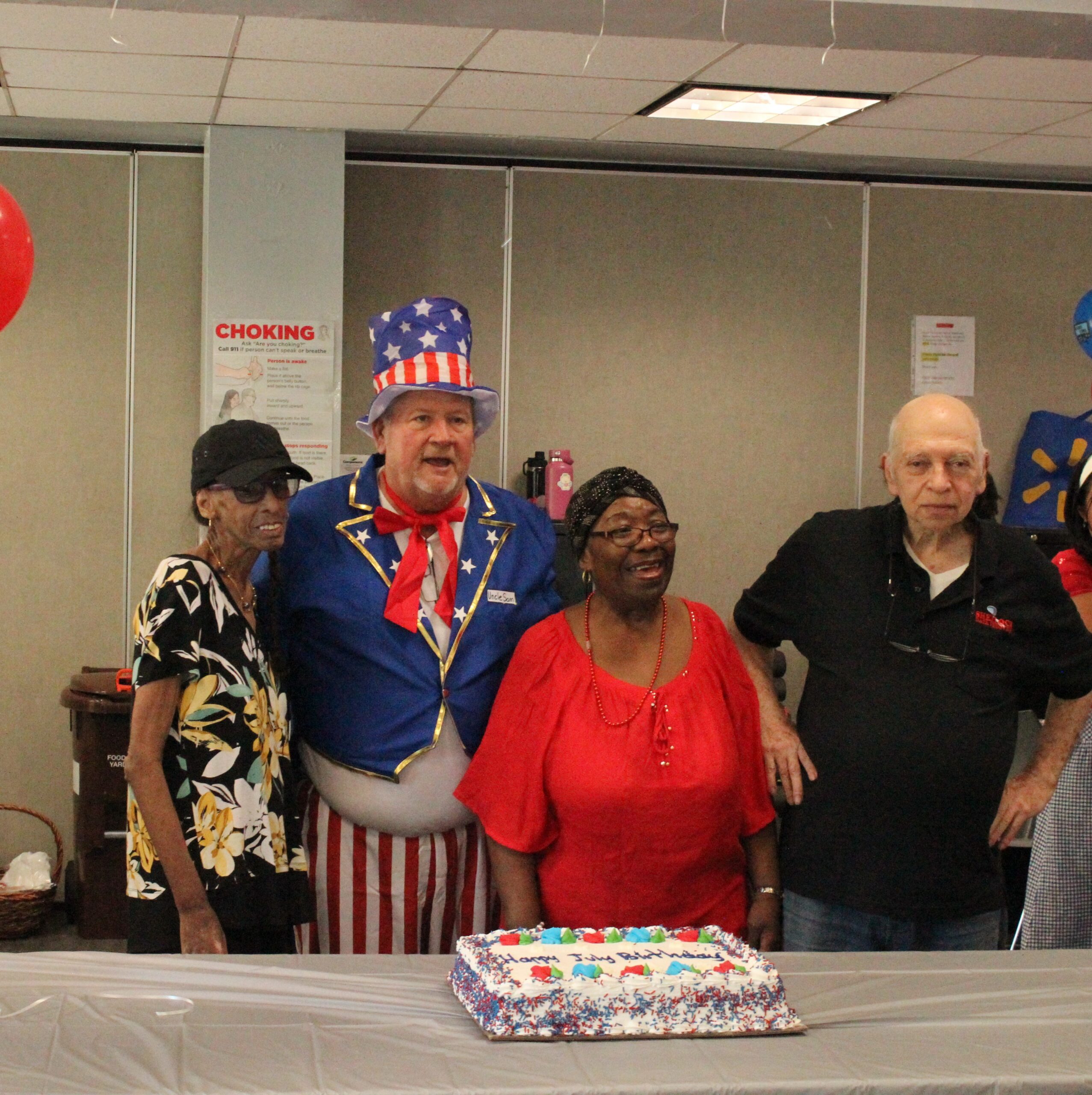 Older adult center members celebrating the July birthdays